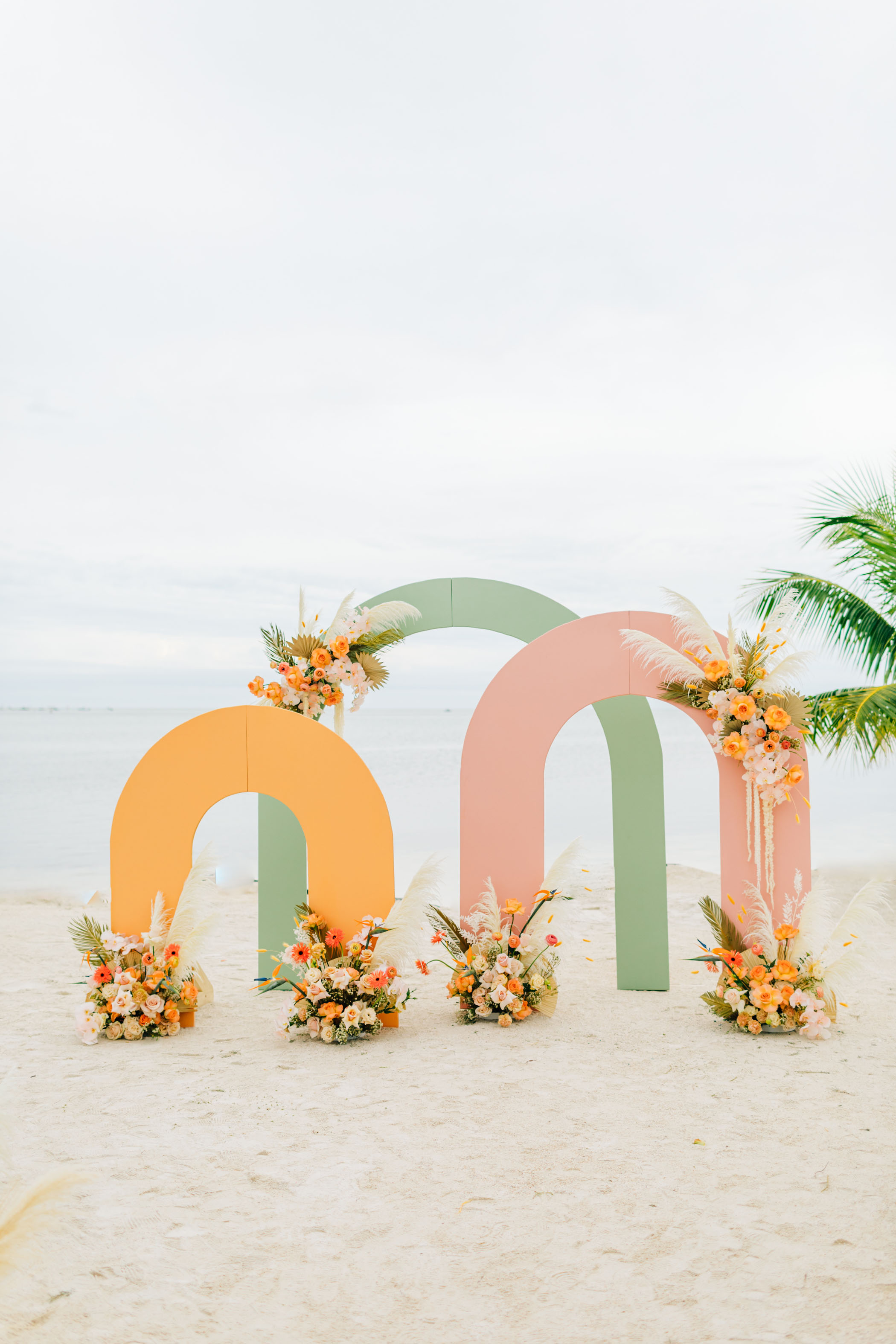 tropical colored arches wedding ceremony decor