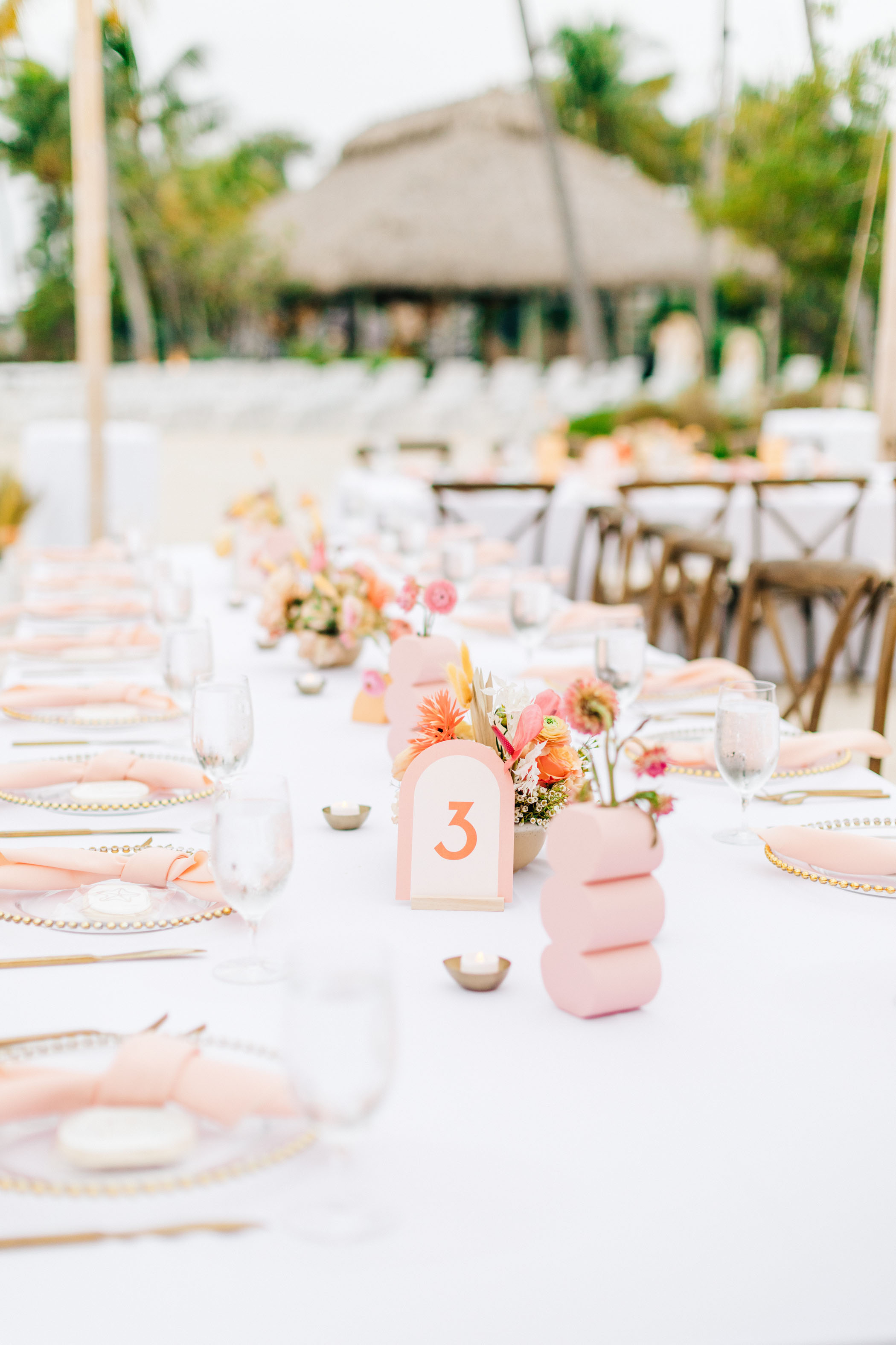 Pink and orange wedding reception decor