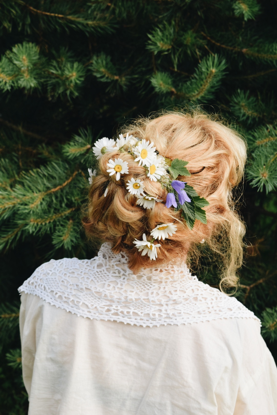 woman with braided hair and flowers
