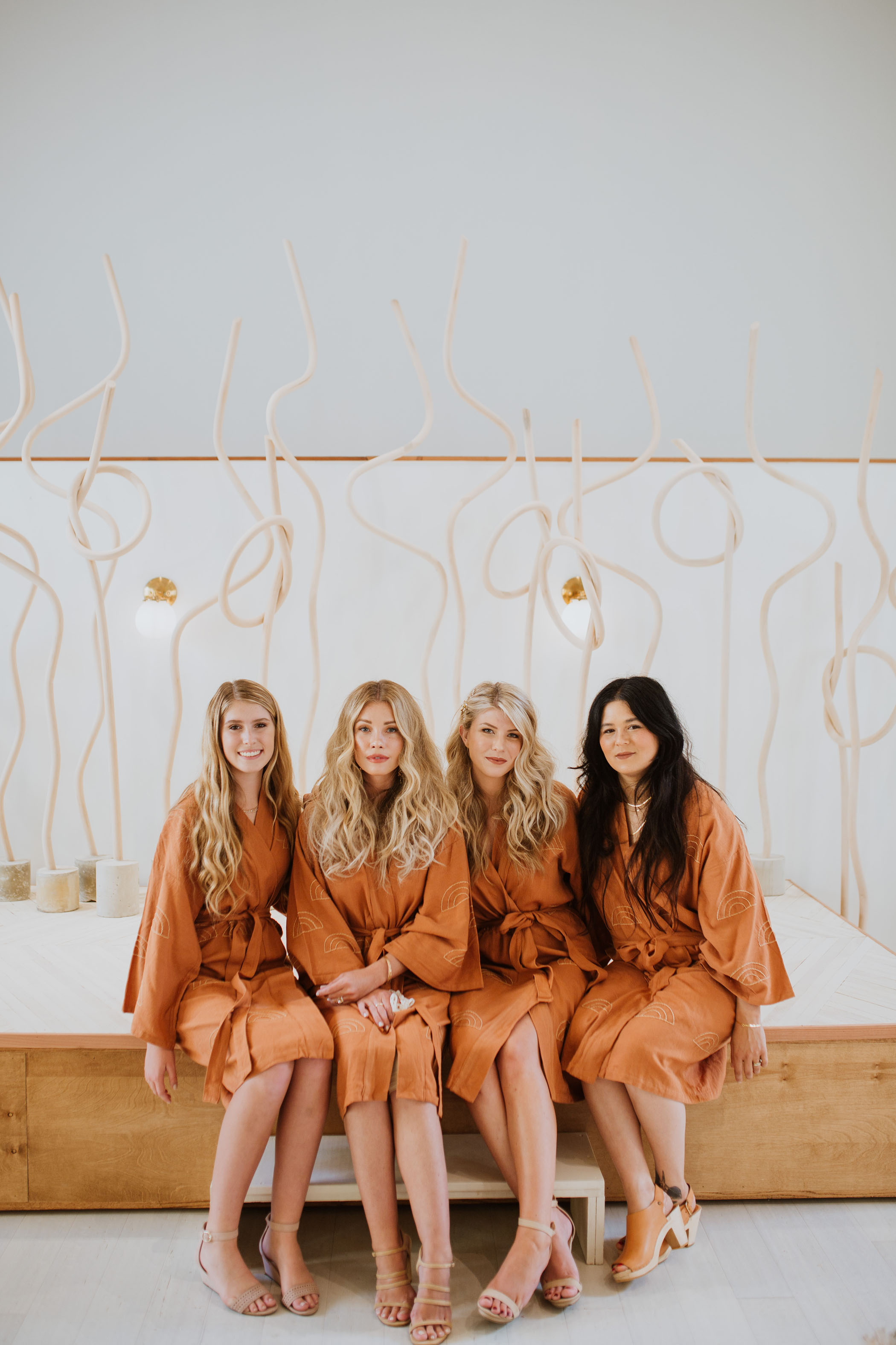 Bridal party in matching terracotta robes