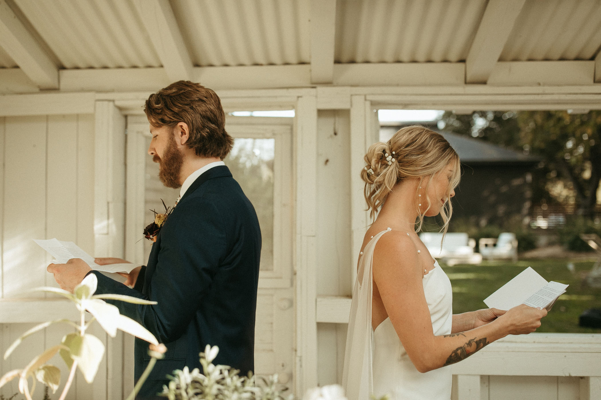 Bride and groom reading wedding day letters