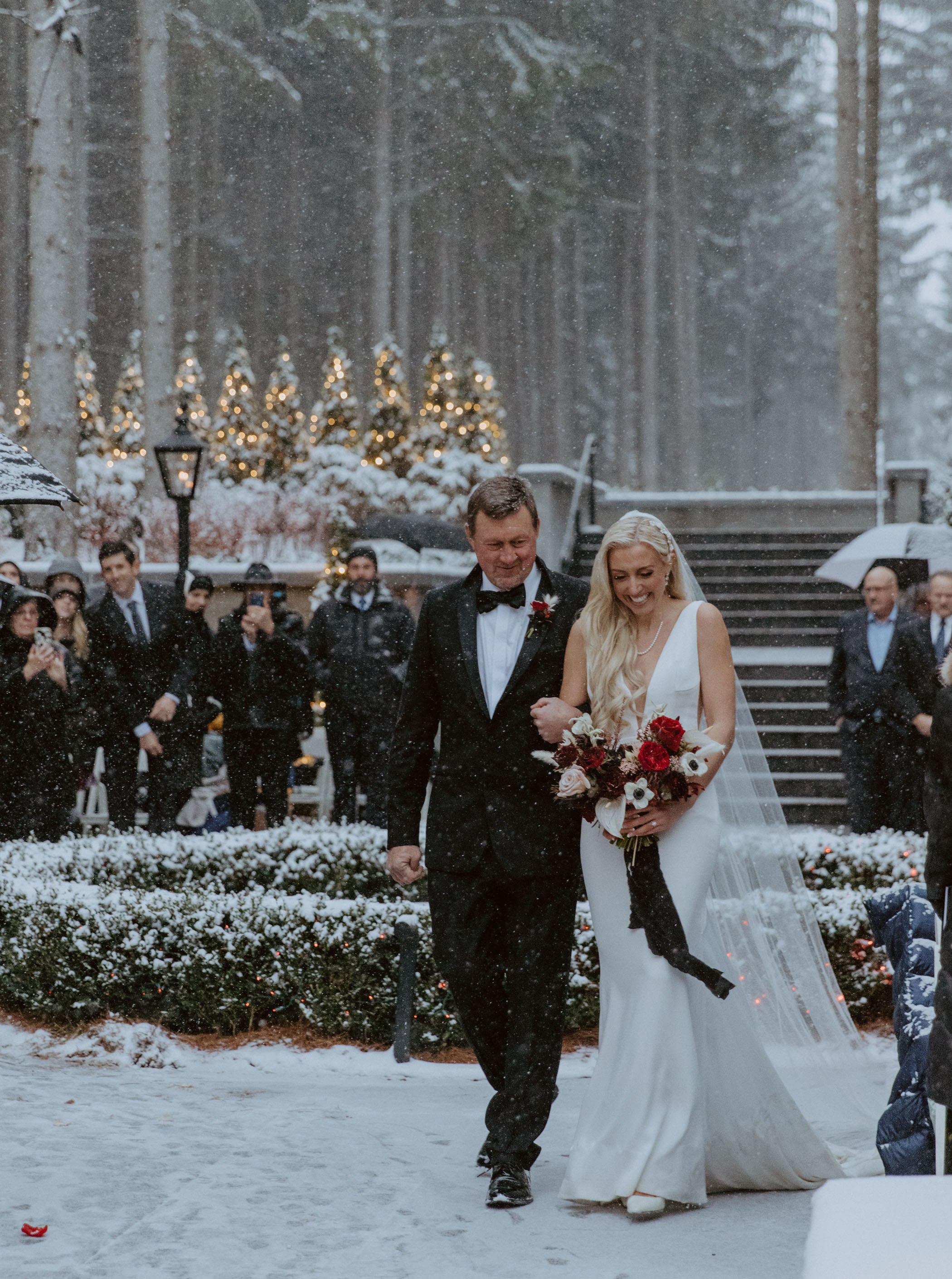 Bride walking down the aisle in snow