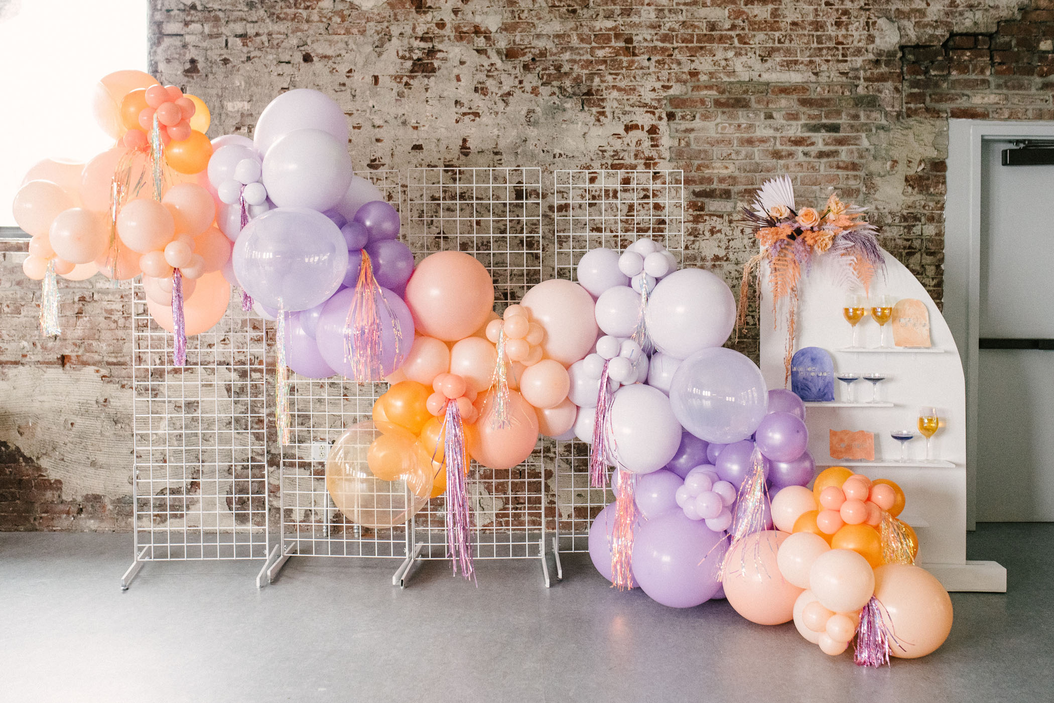 Purple and orange balloon garland