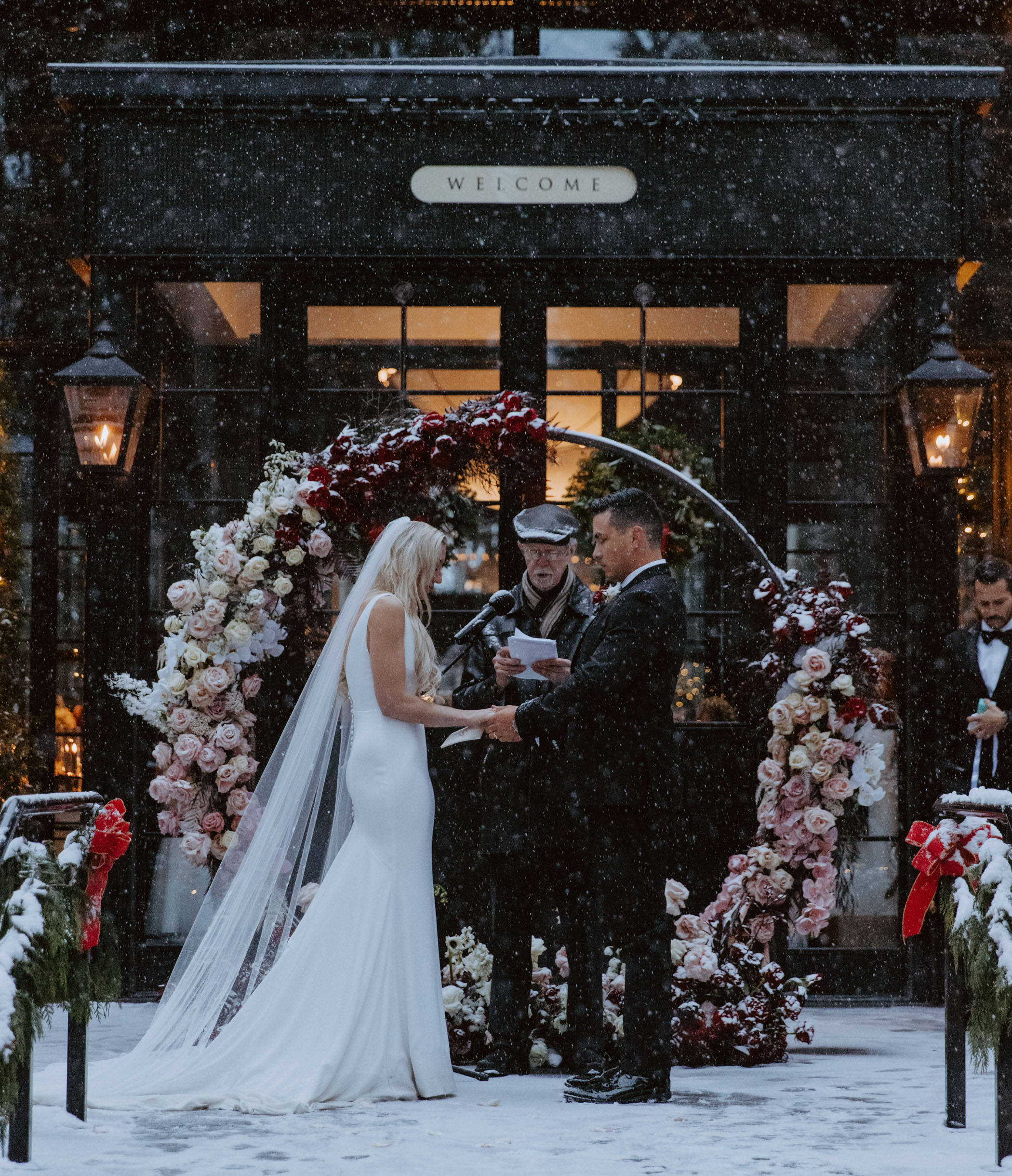 Bride and groom saying vows in the snow