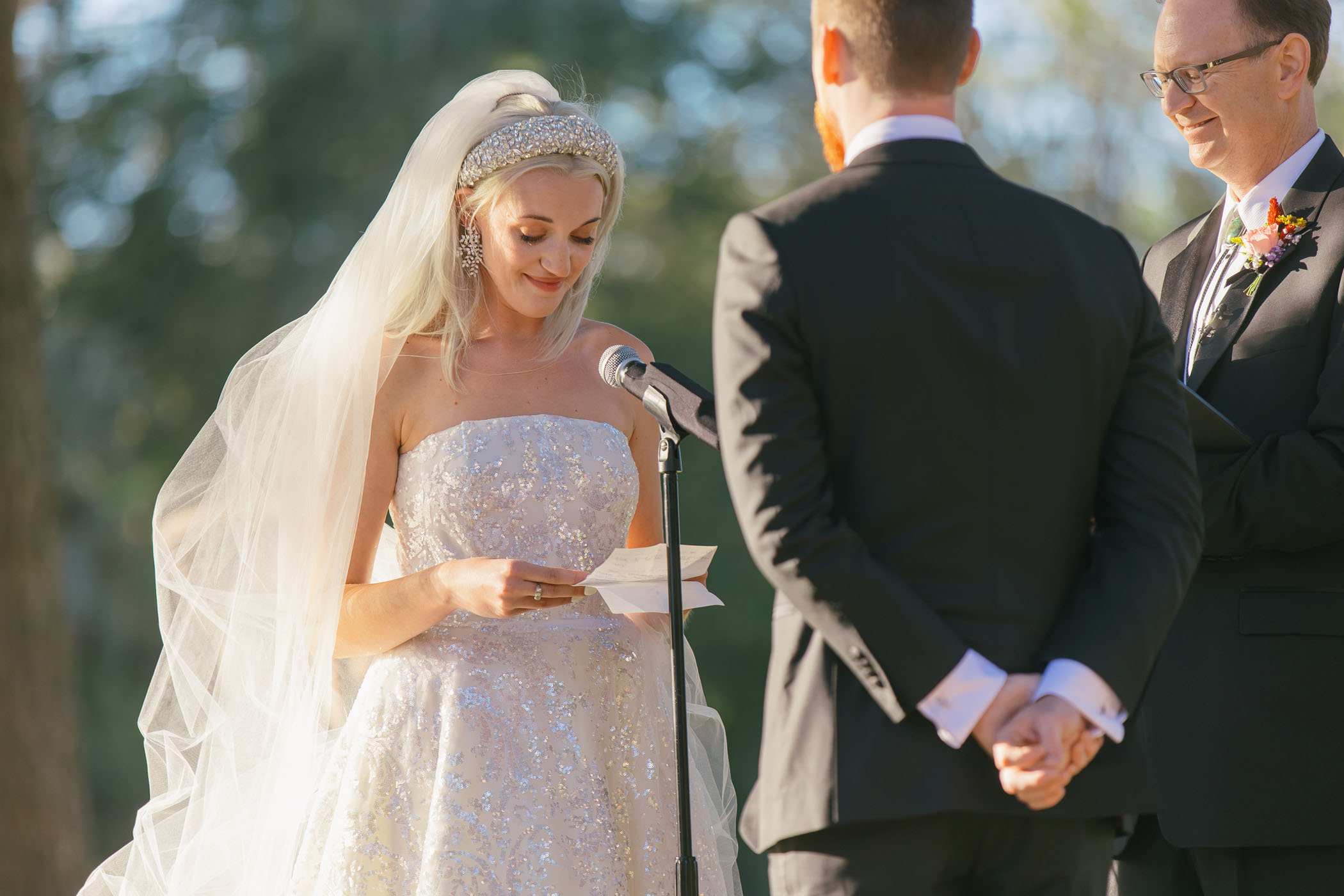 Bride reading vows at altar 