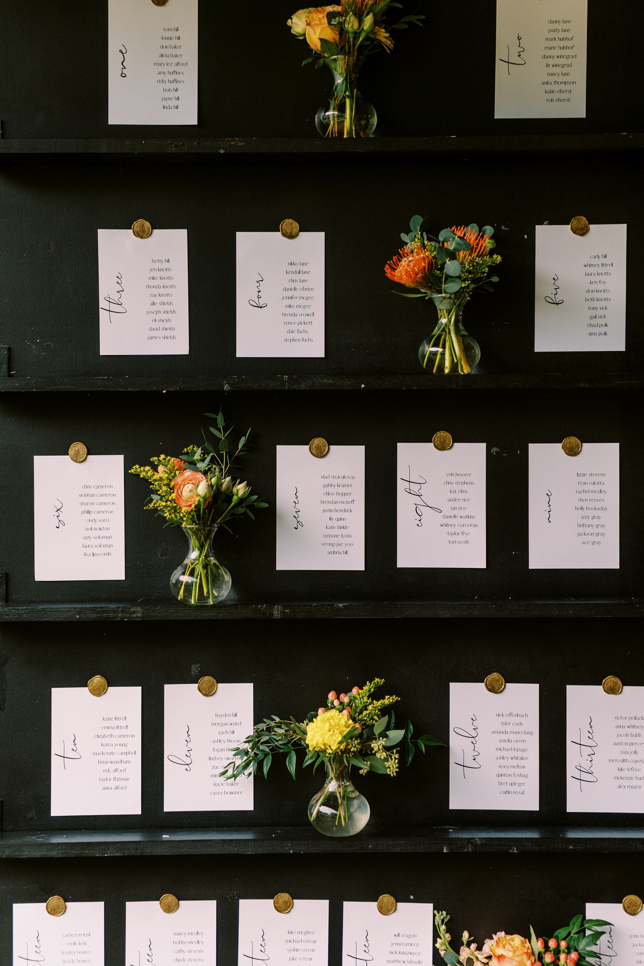 wedding seating chart with mini floral arrangements