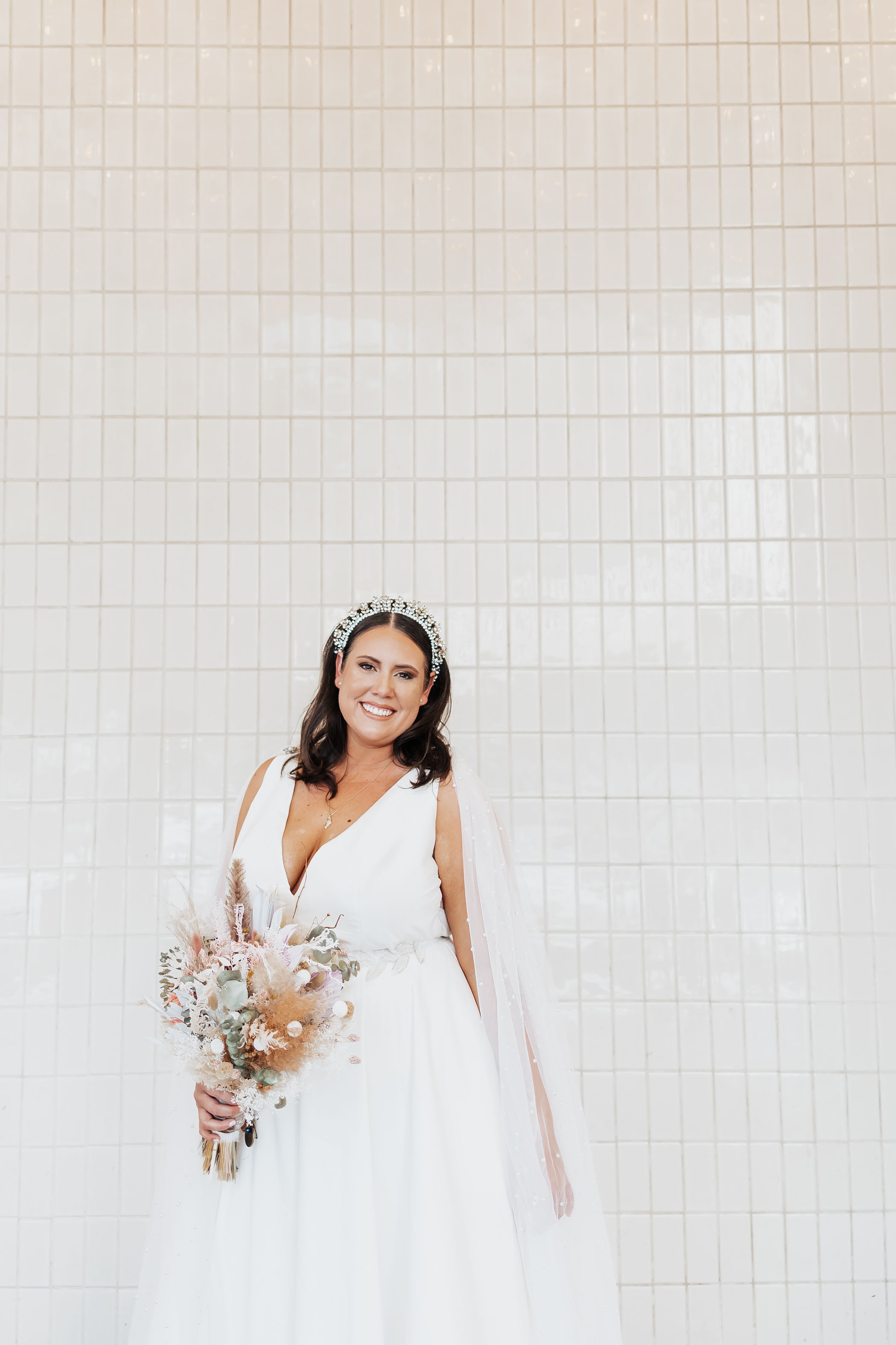 Las Vegas bride with jeweled headband and dried floral bouquet