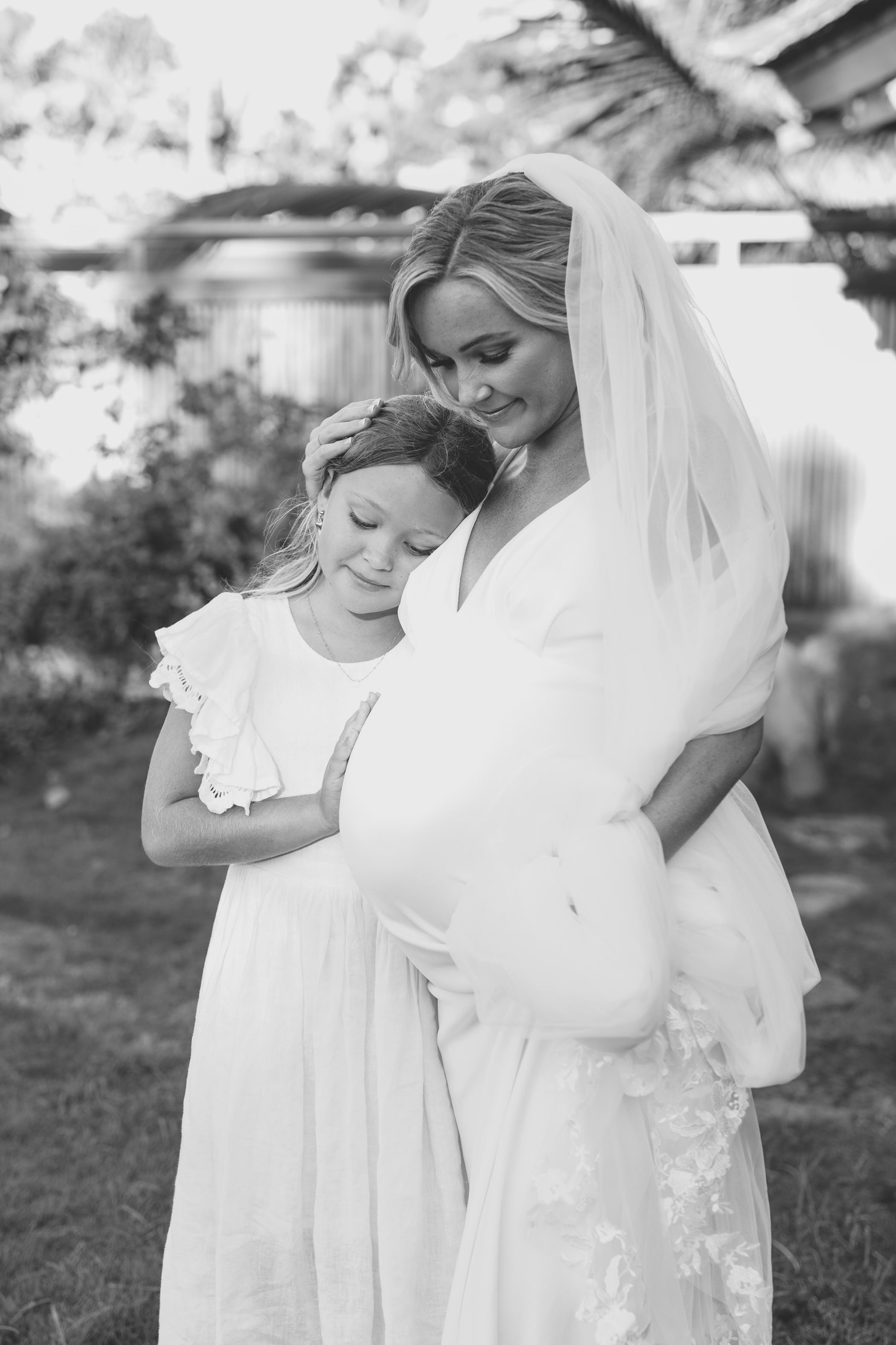 Pregnant bride with daughter