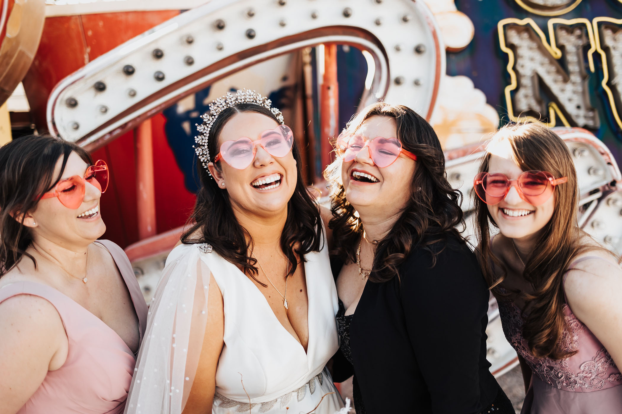Bride and bridesmaids prop sunglasses