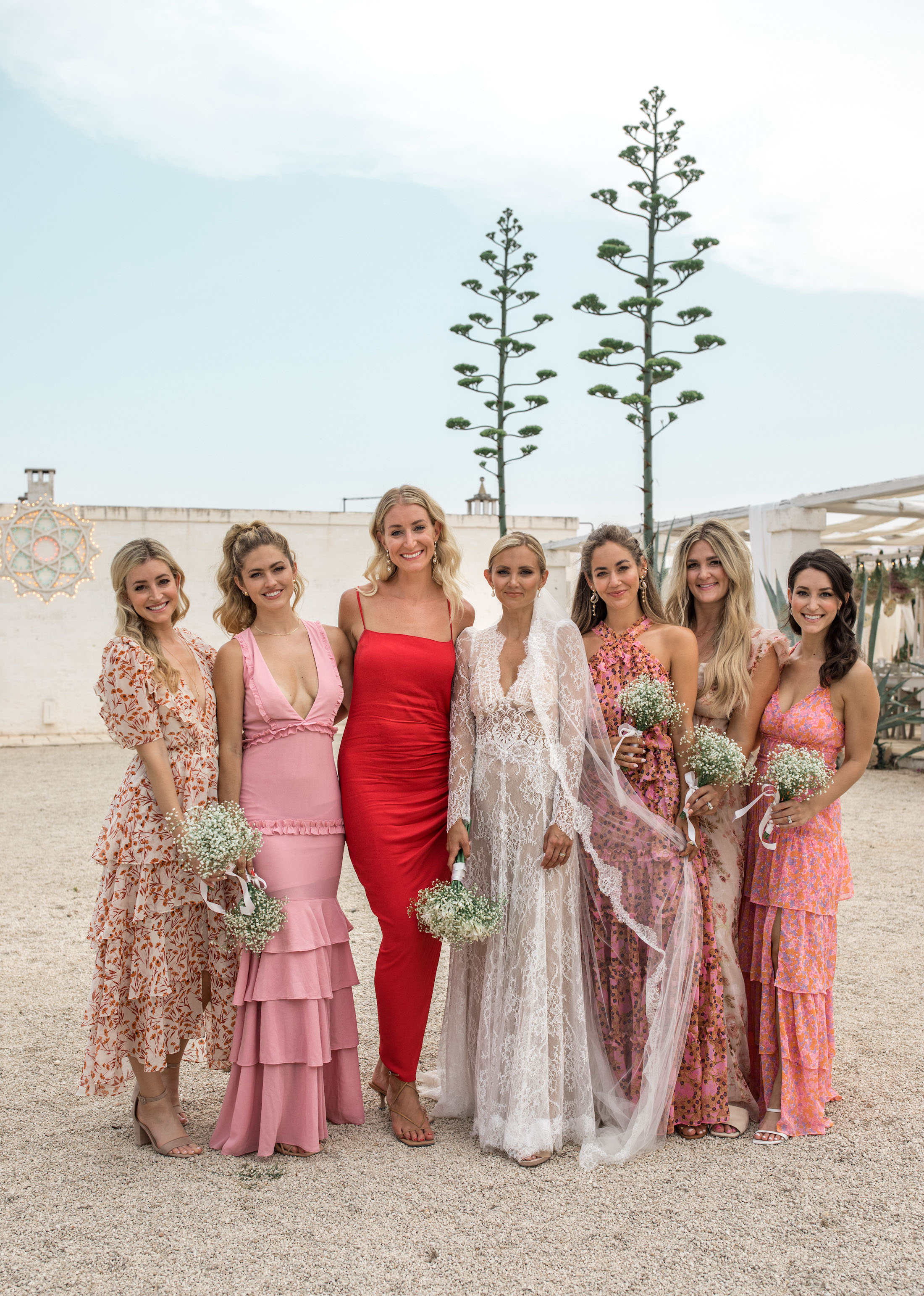 mismatched pink and coral bridesmaids dresses