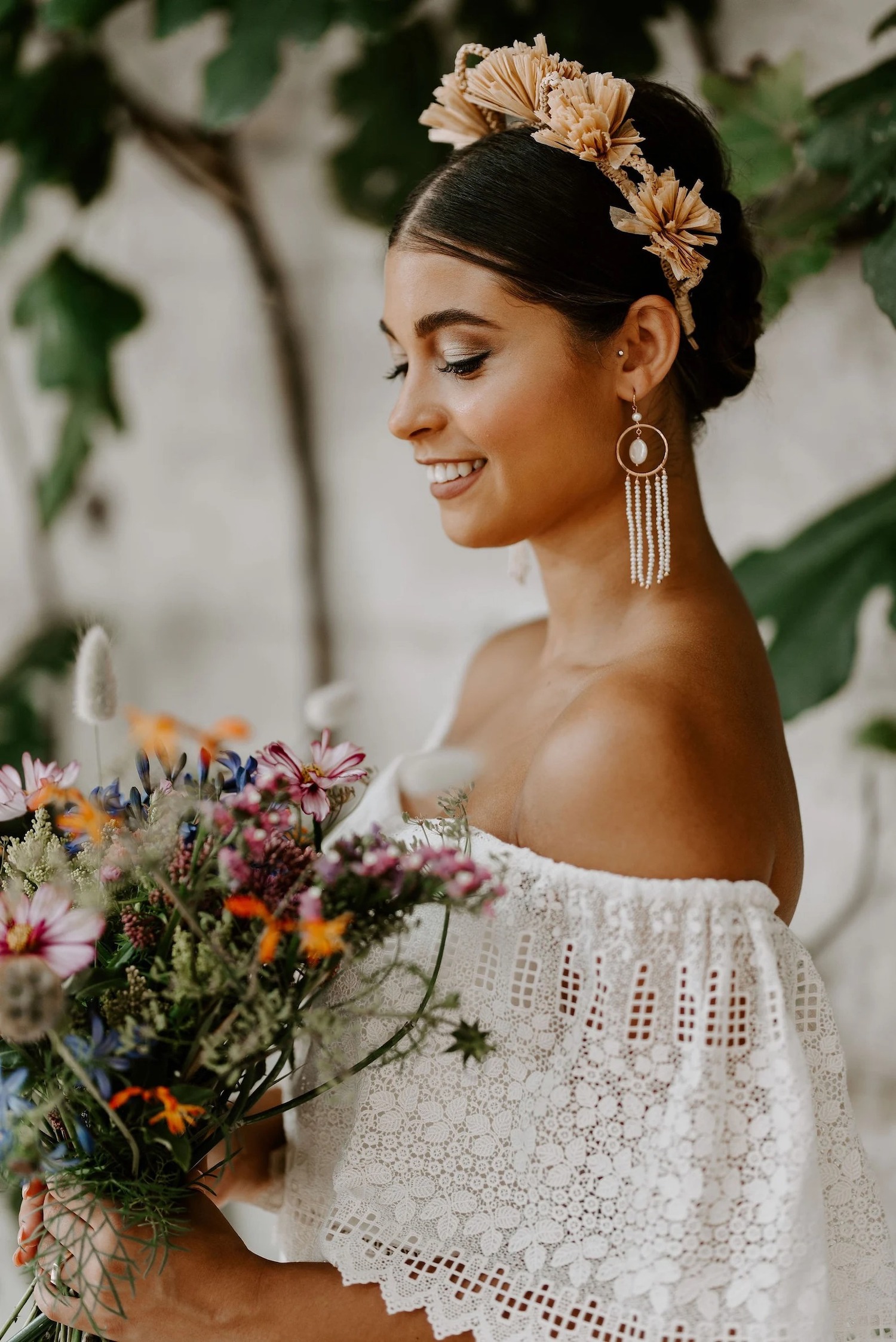bride wearing boho white beaded tassel earrings 
