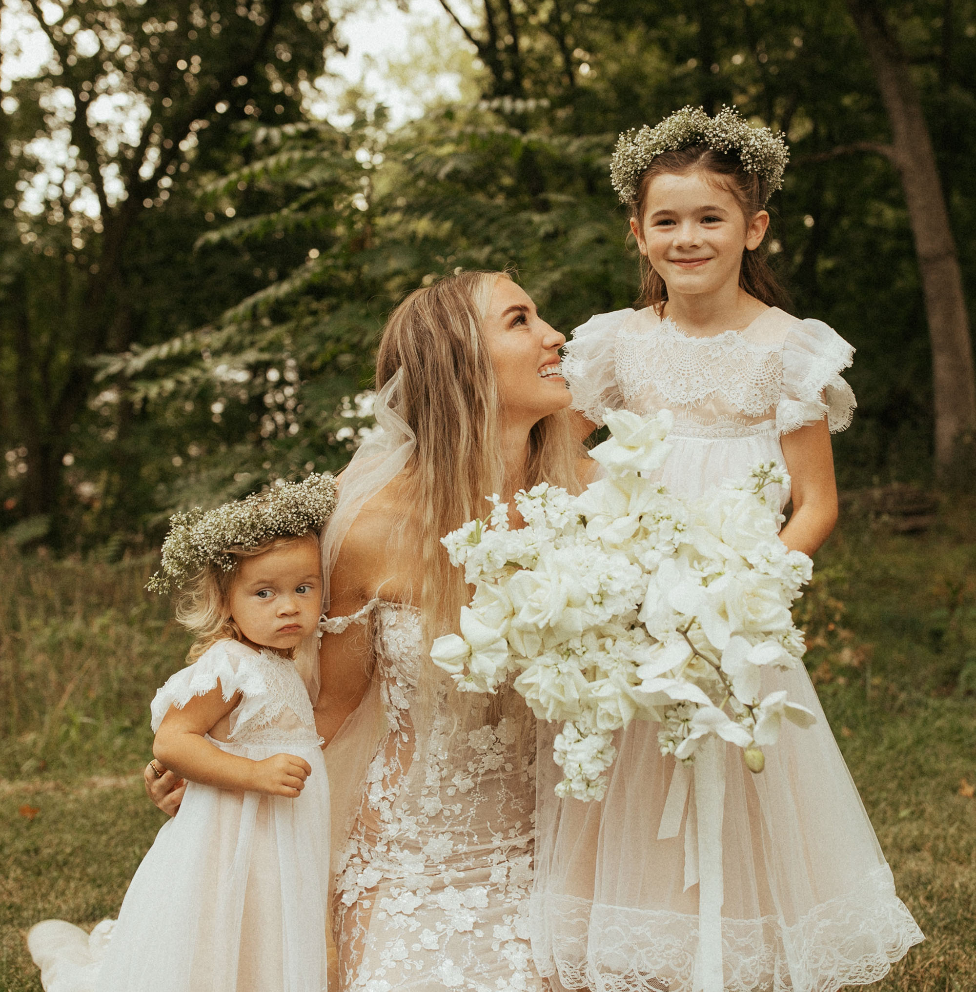 bride with flower girls in flower crowns