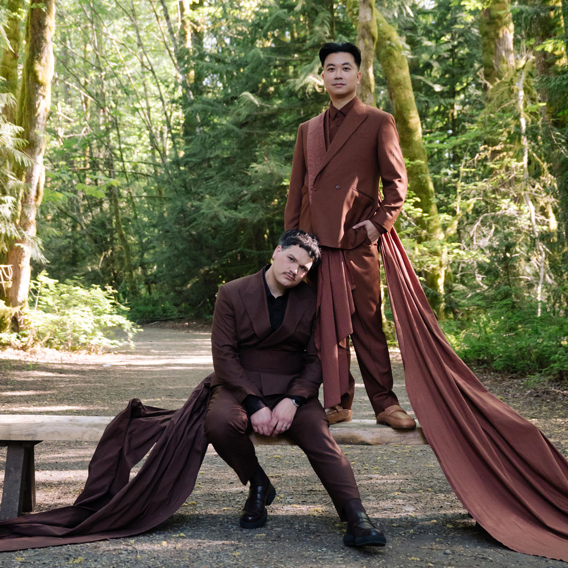 two grooms brown suits with capes
