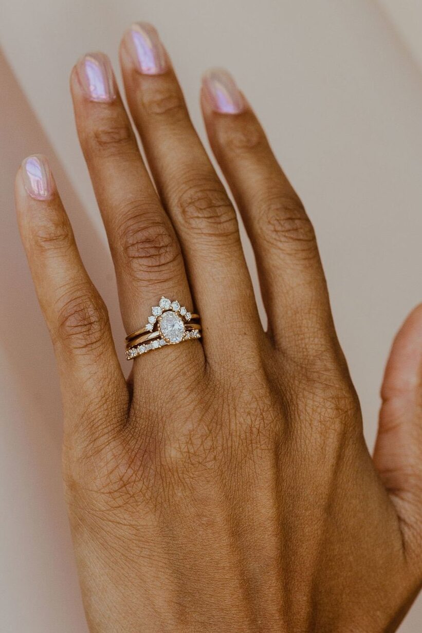 oval solitaire diamond ring with matching tracing bands