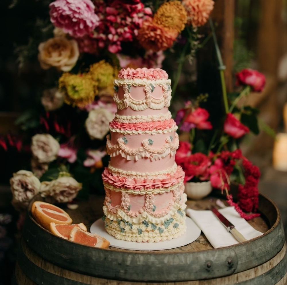 pink rococo inspired vintage wedding cake with blue and white rose design ideas