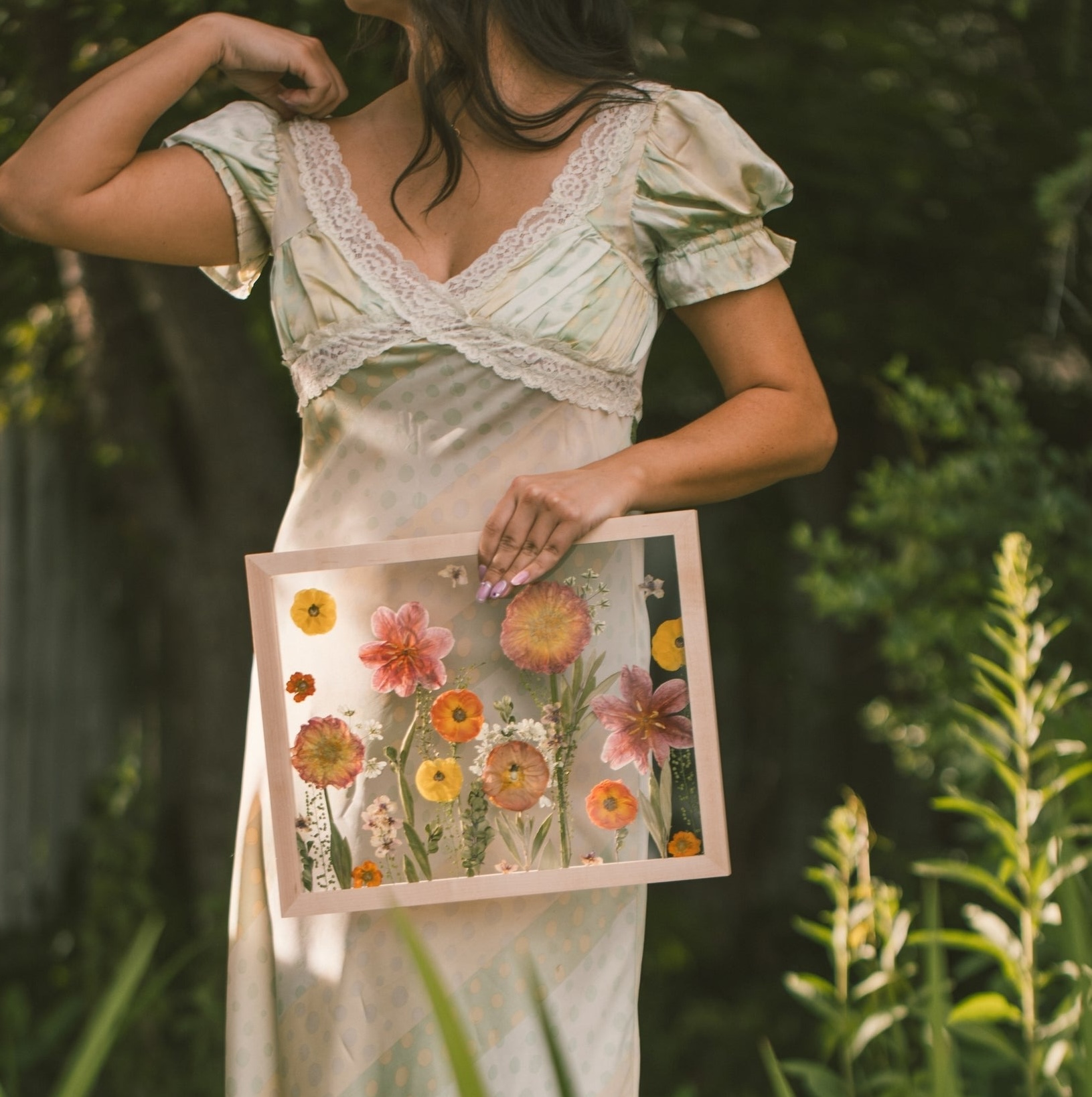 wedding bouquet preservation ideas featuring a custom pressed floral art frame