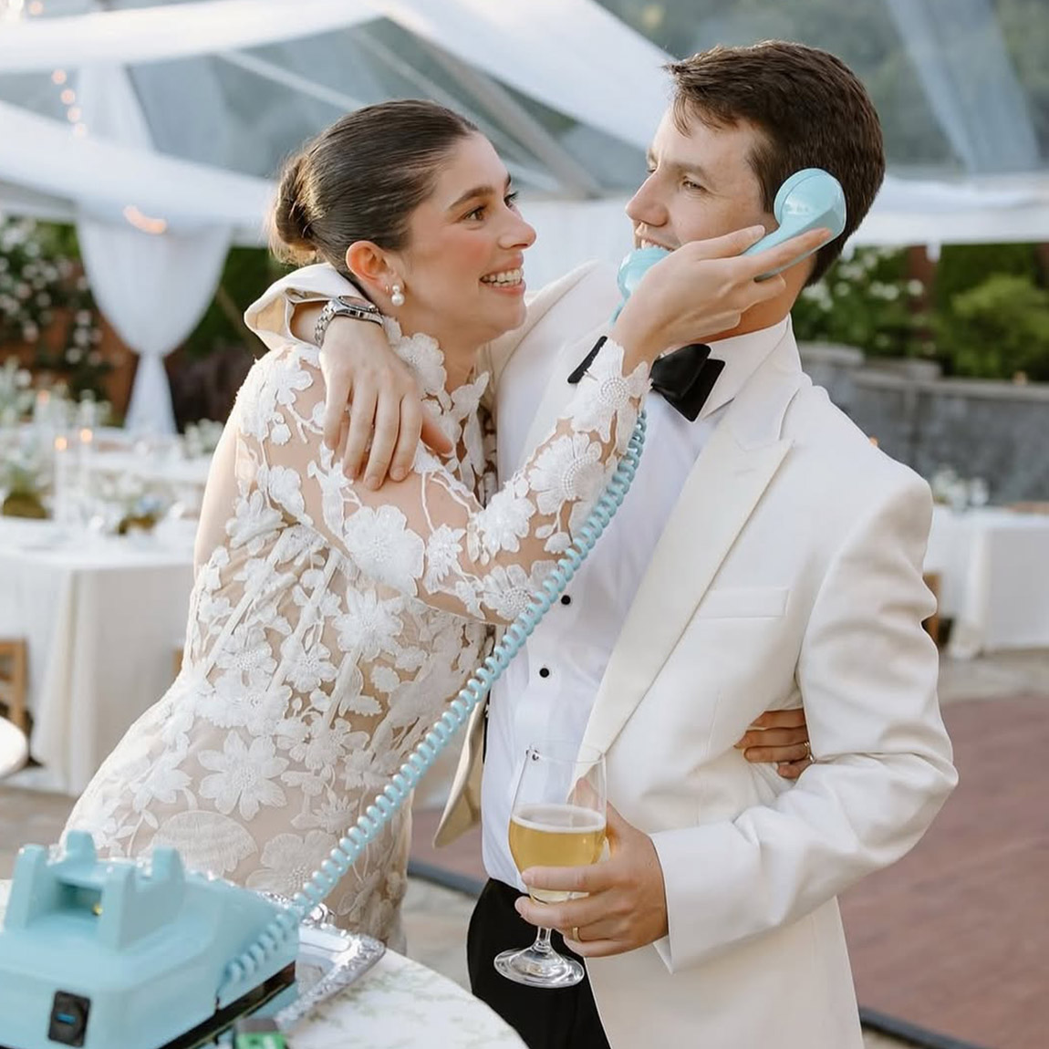 bride and leaving a message on an audio guestbook at their wedding