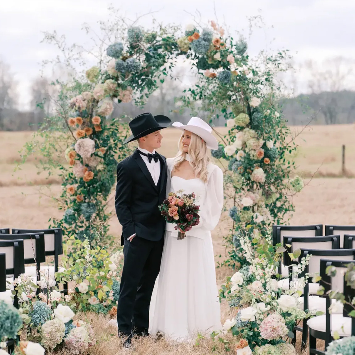 bride groom cowboy hats ceremony