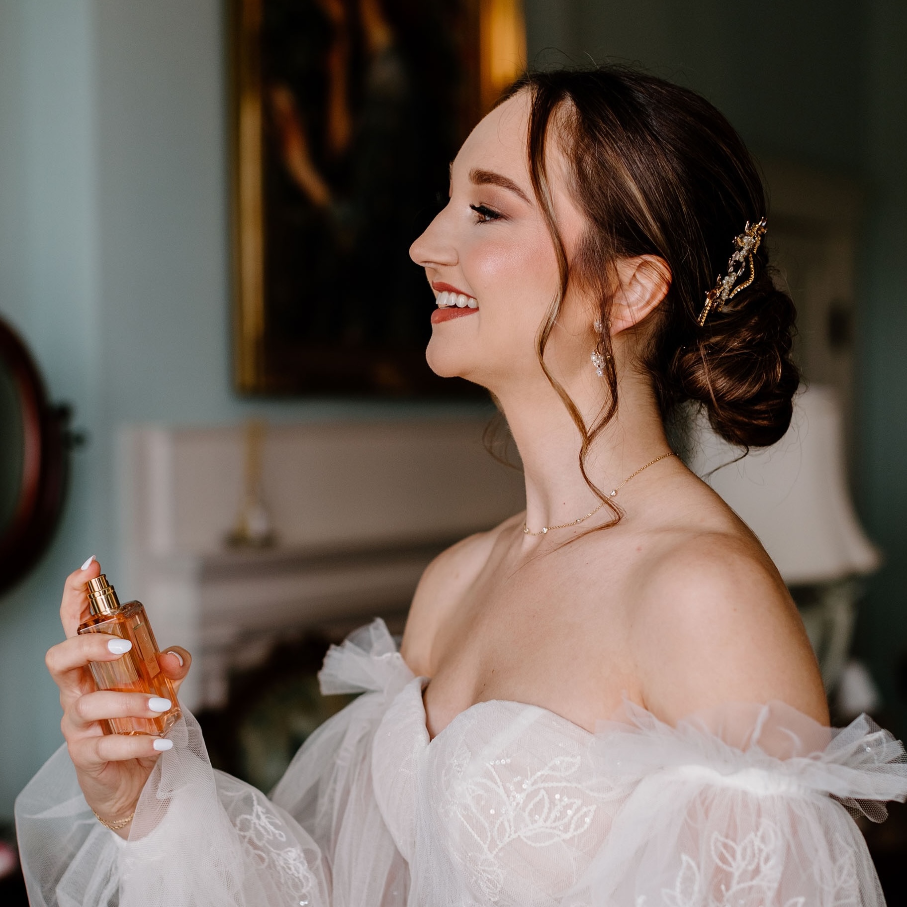 bride spraying one of the best wedding perfumes before her ceremony