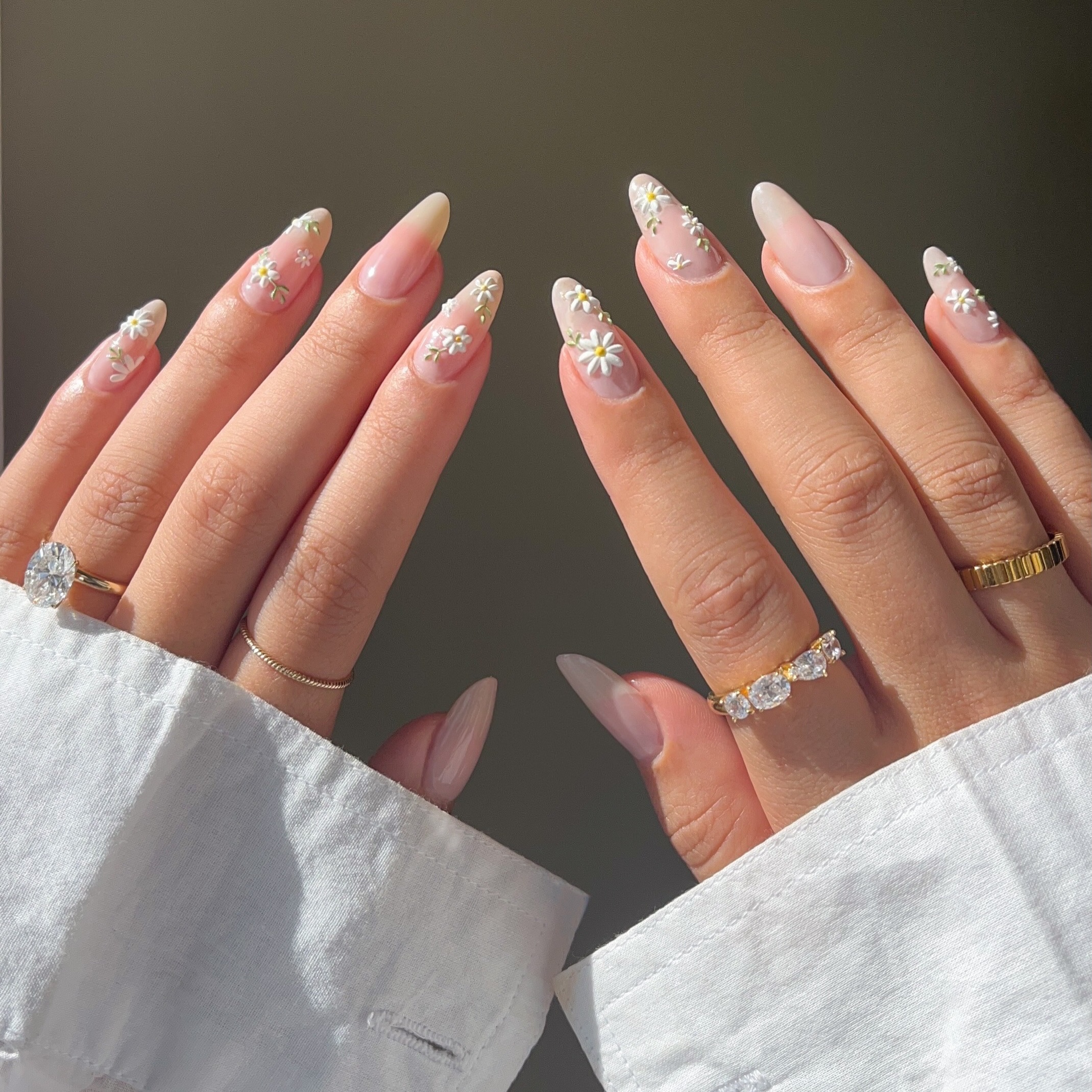 sheer simple almond nails with white daisy designs